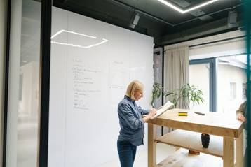 Pregnant woman looking over papers - Pregnancy Discrimination